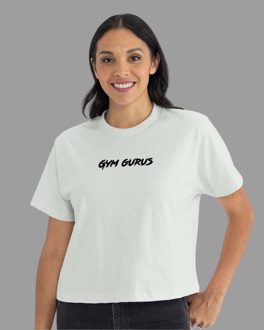 Woman wearing a light green t-shirt with 'Gym Gurus' text on a white background
