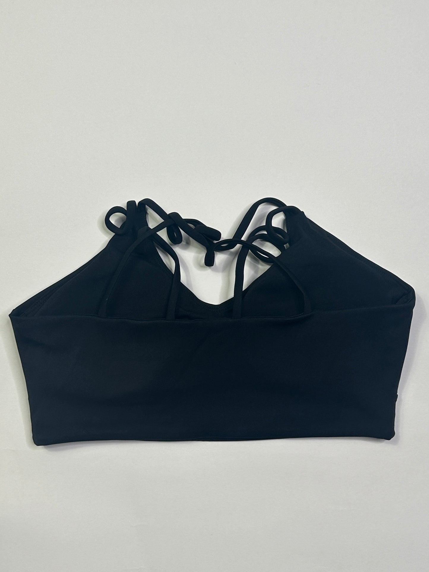 Black bandeau top on a light gray background
